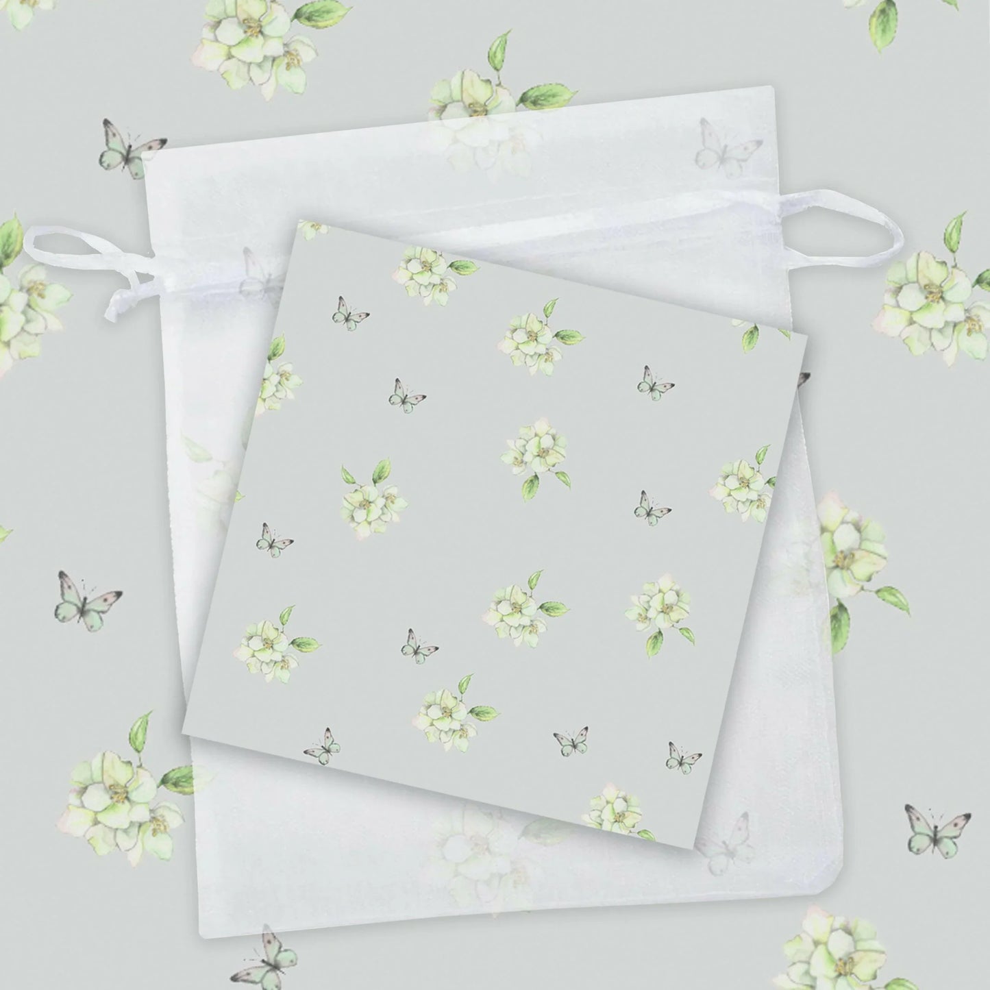 a repeating pattern of white flowers and butterflies on a light gray background.