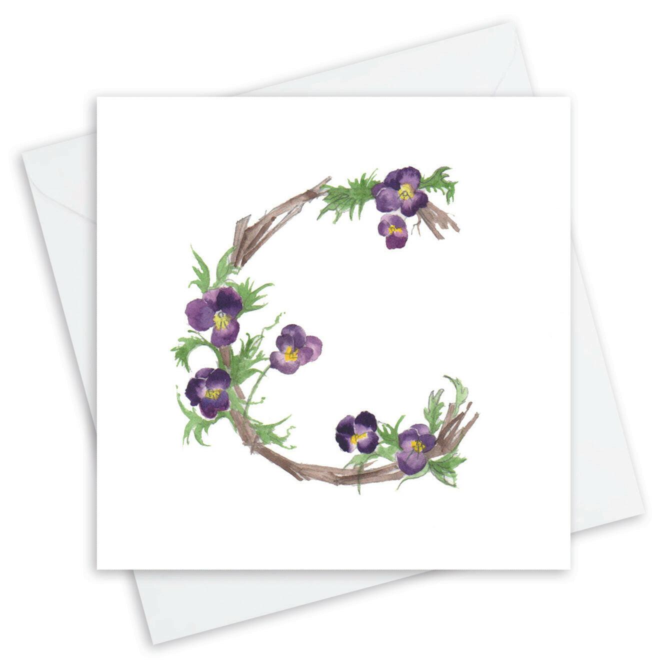 Handcrafted Crumble and Core card with letter C formed by purple flowers and branches