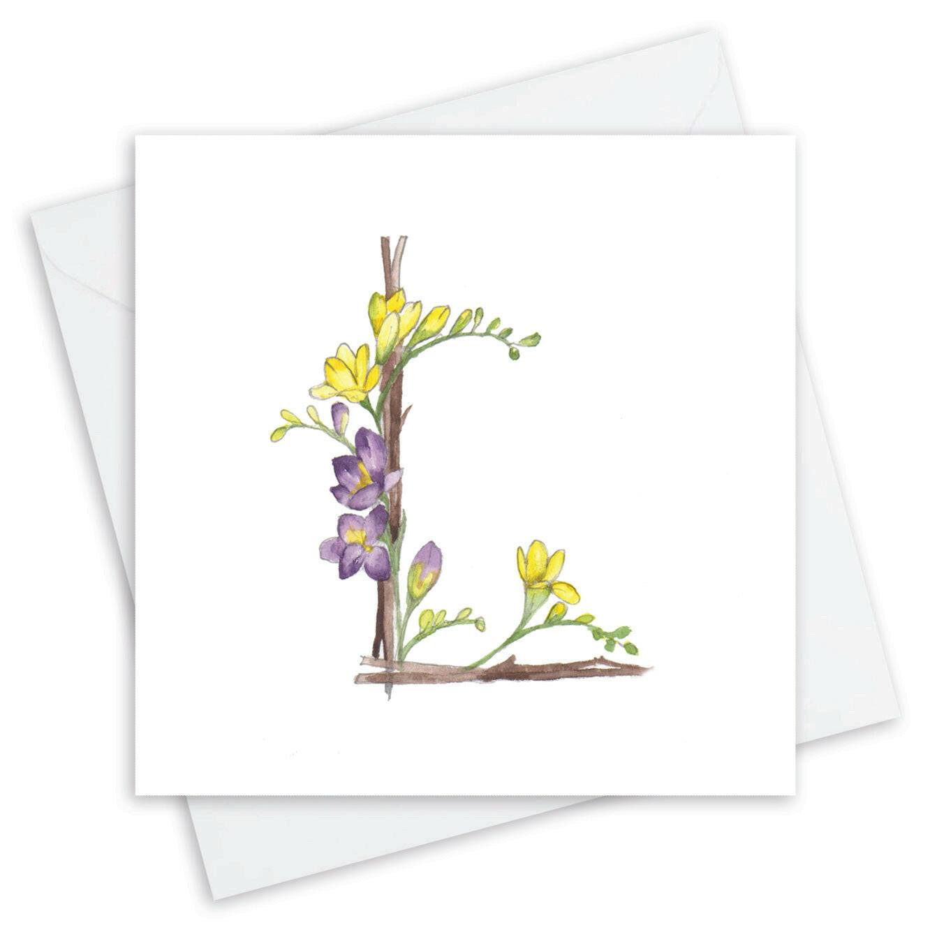 Crumble and Core handmade card with floral letter L design in yellow and purple watercolor