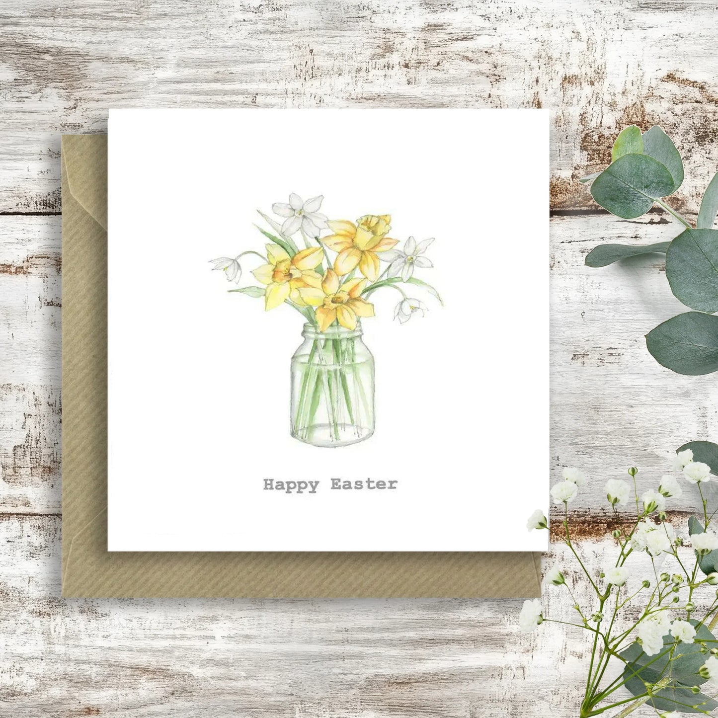 Crumble and Core handcrafted Easter card with daffodils in a glass jar on rustic wood