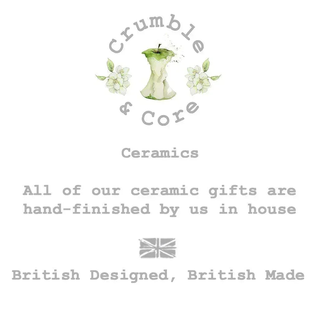 Crumble and Core ceramics logo with apple core, floral accents, and British made message